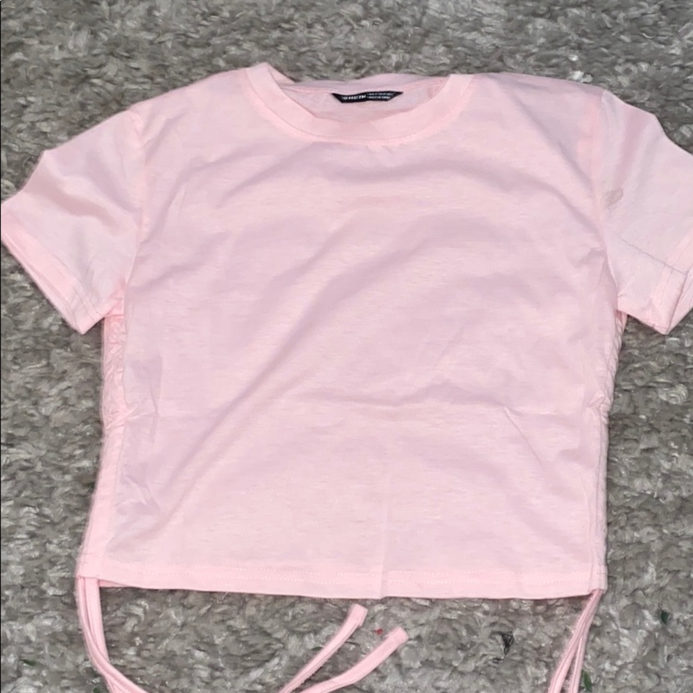 Size M Drawstring side solid tee